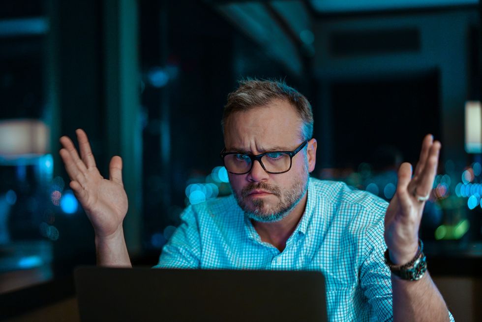 Man looking annoyed at computer