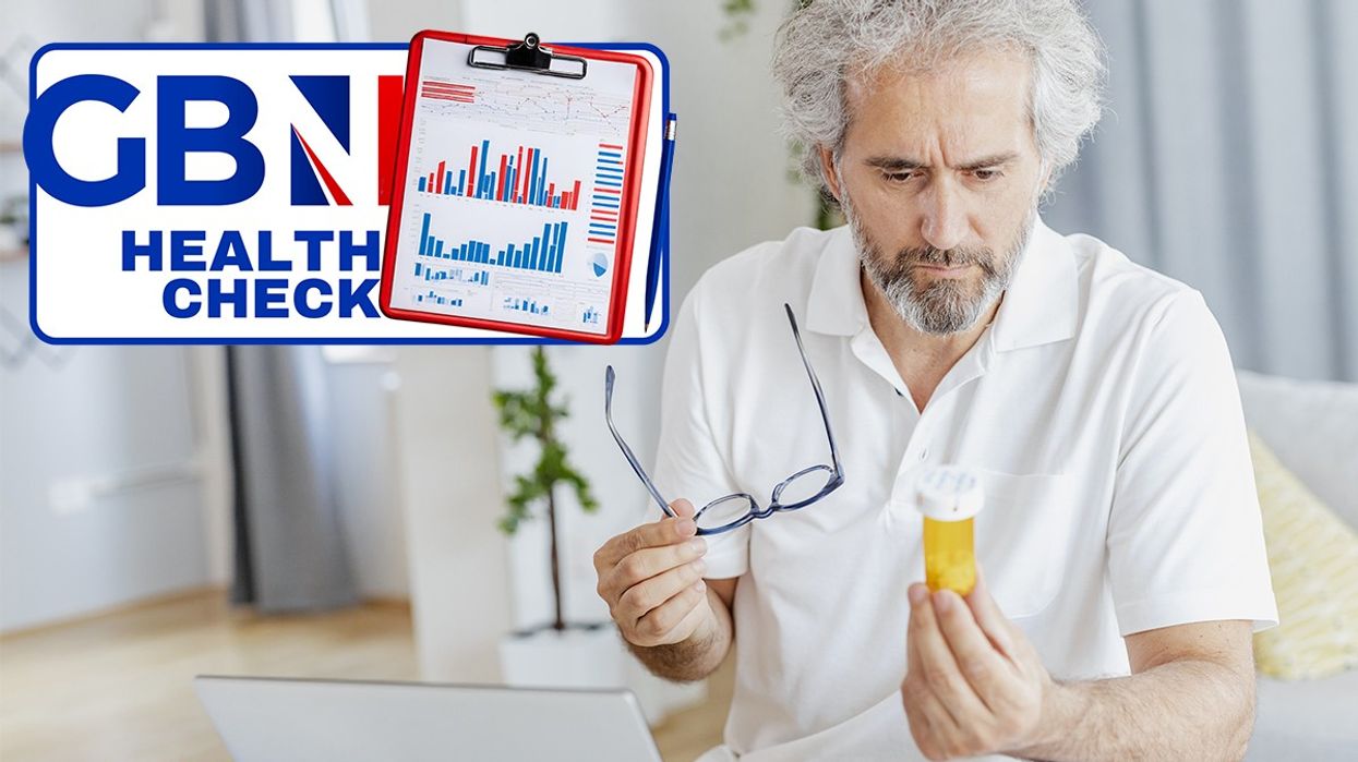 Man looking at a supplement bottle