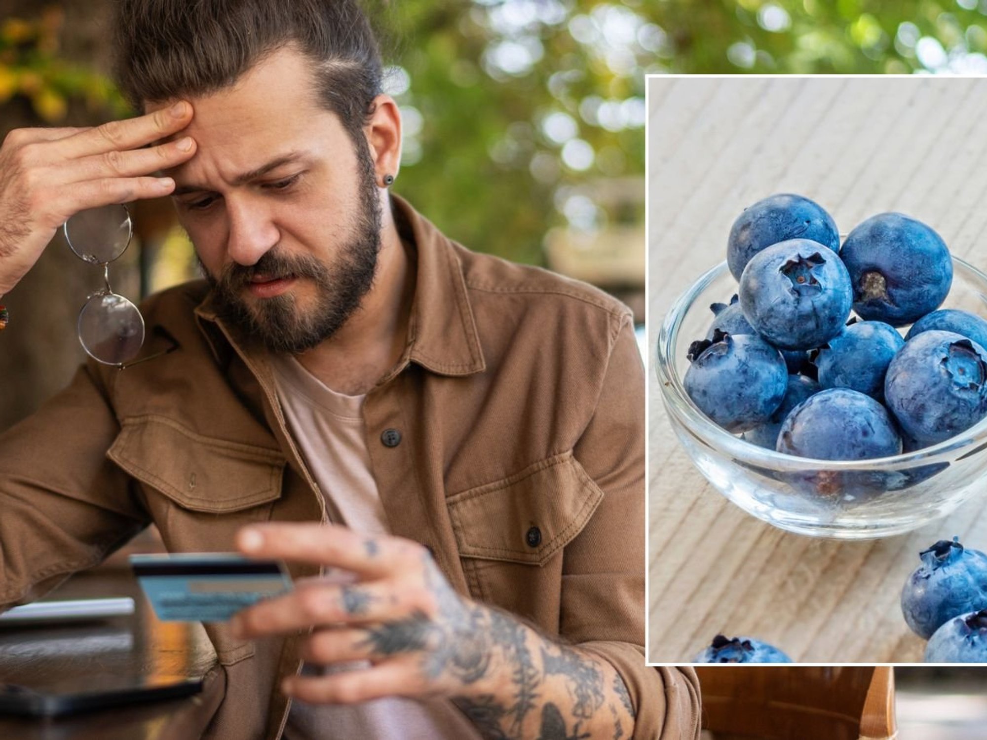 Man looking at bank card, blueberries
