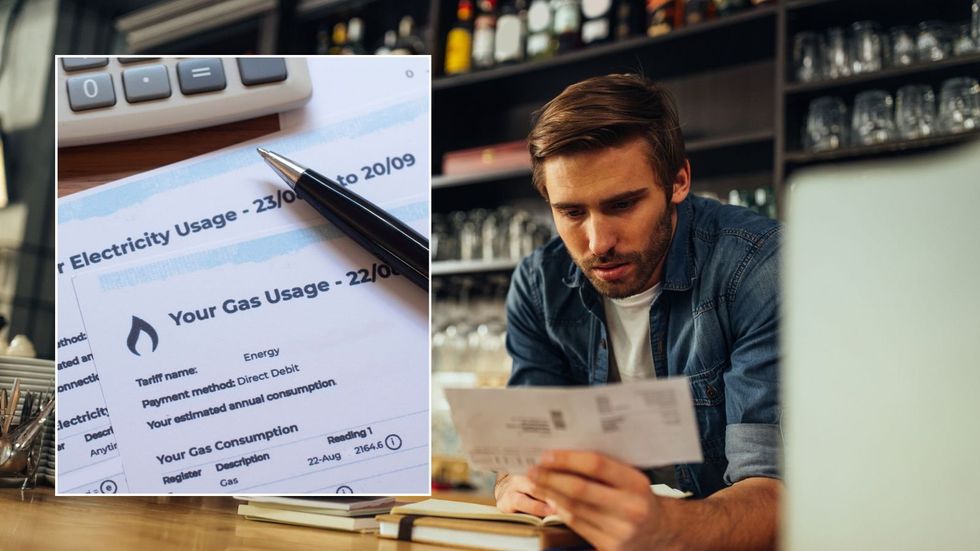 Man looking at bill and energy bill