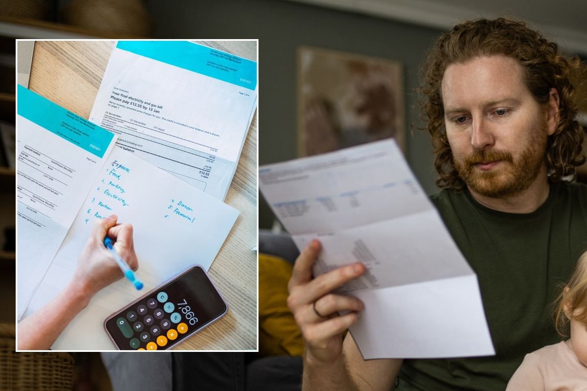 Man looking at bill and energy bills