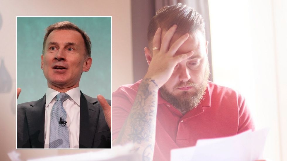 Man looking at bill and Jeremy Hunt at event
