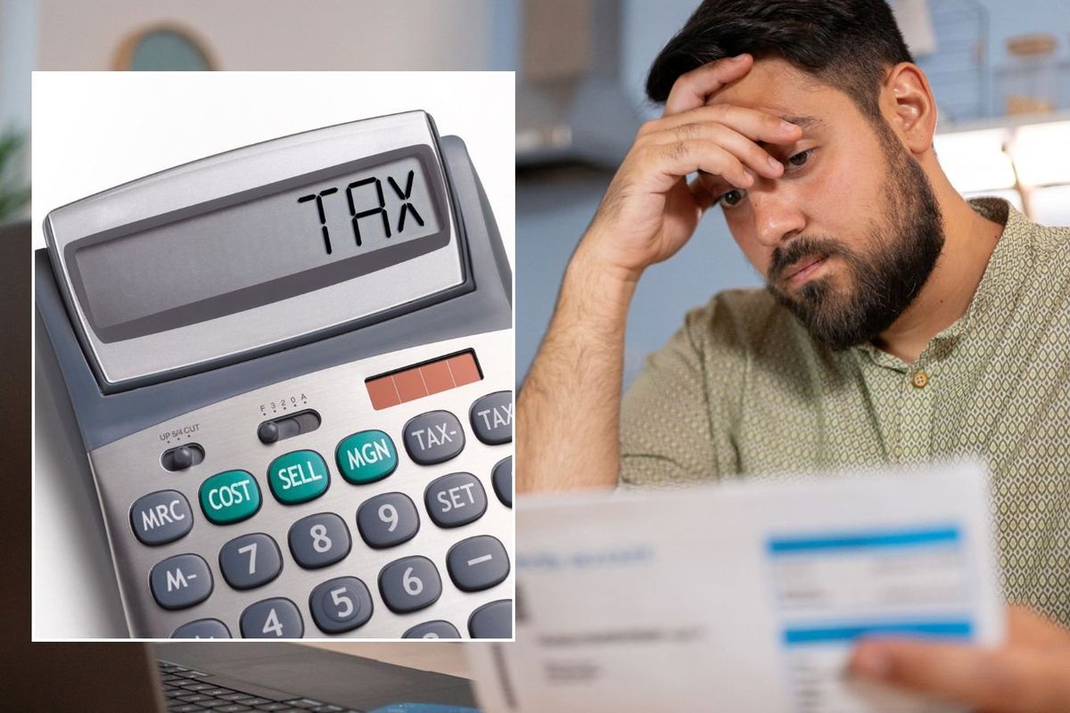 Man looking at bill and tax written on calculator