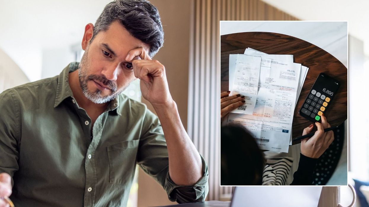 Man looking at bill and woman doing her finances