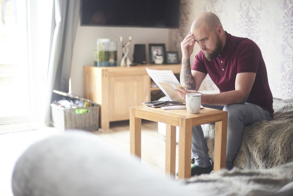 Man looking at bills