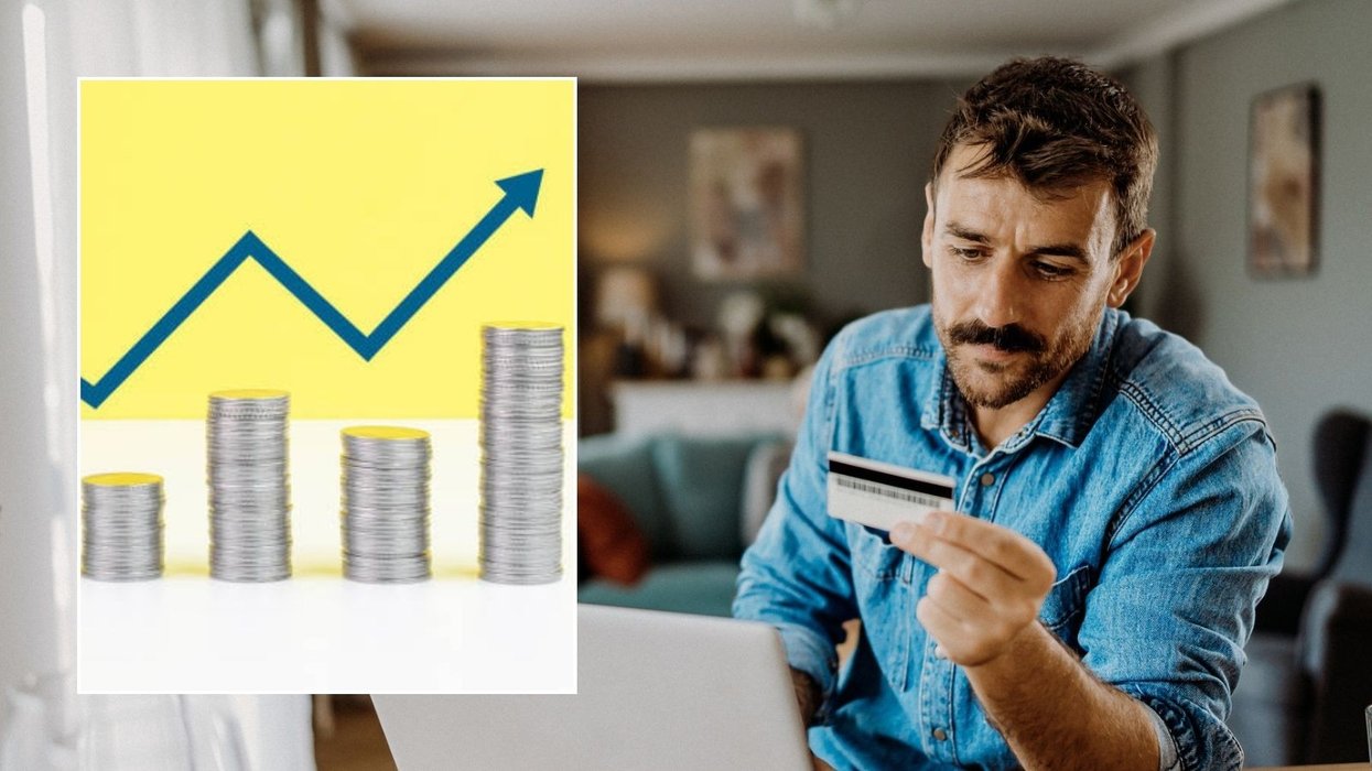 Man looking at card and rising interest rate