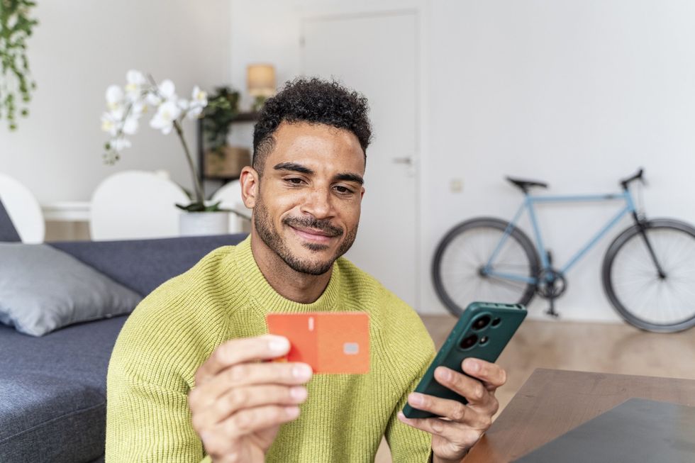 Man looking at card