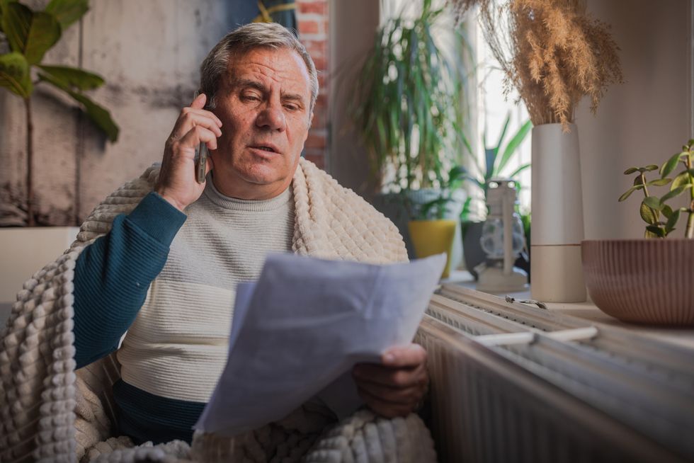 Man looking at energy bills