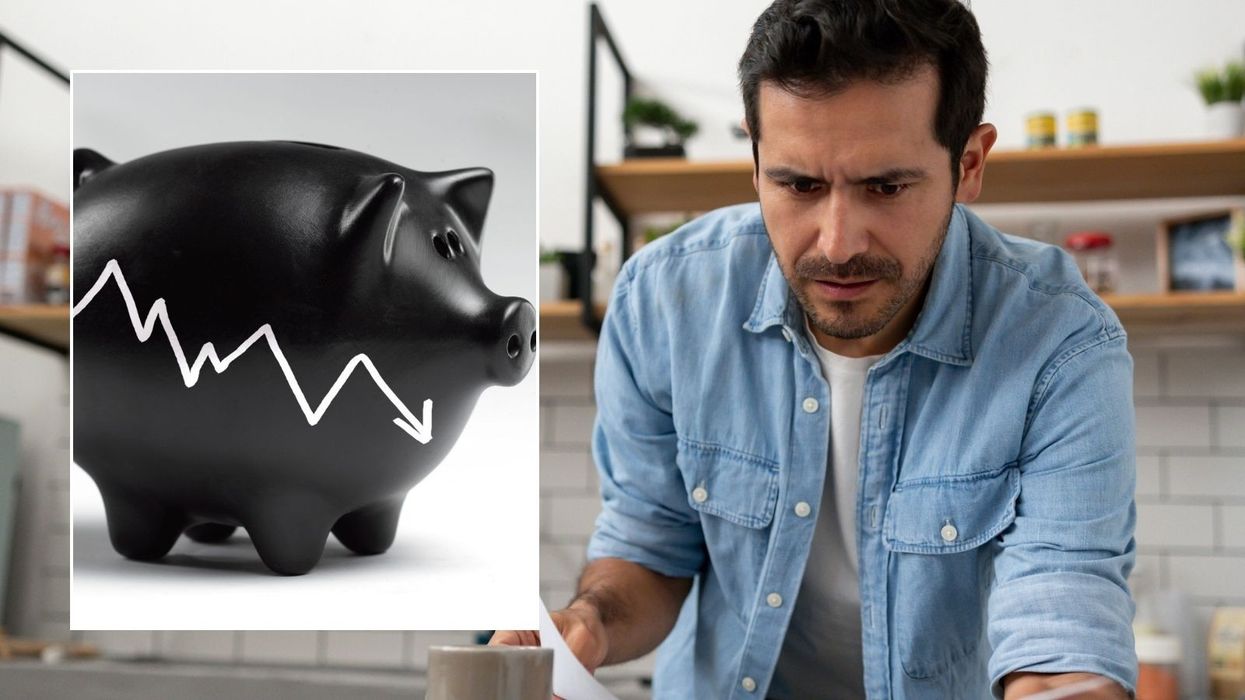 Man looking at finances and piggy bank