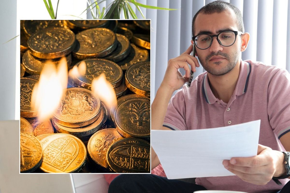 Man looking at finances, money burning