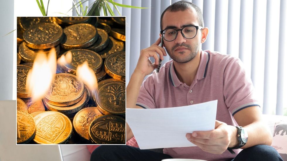 Man looking at finances, money burning