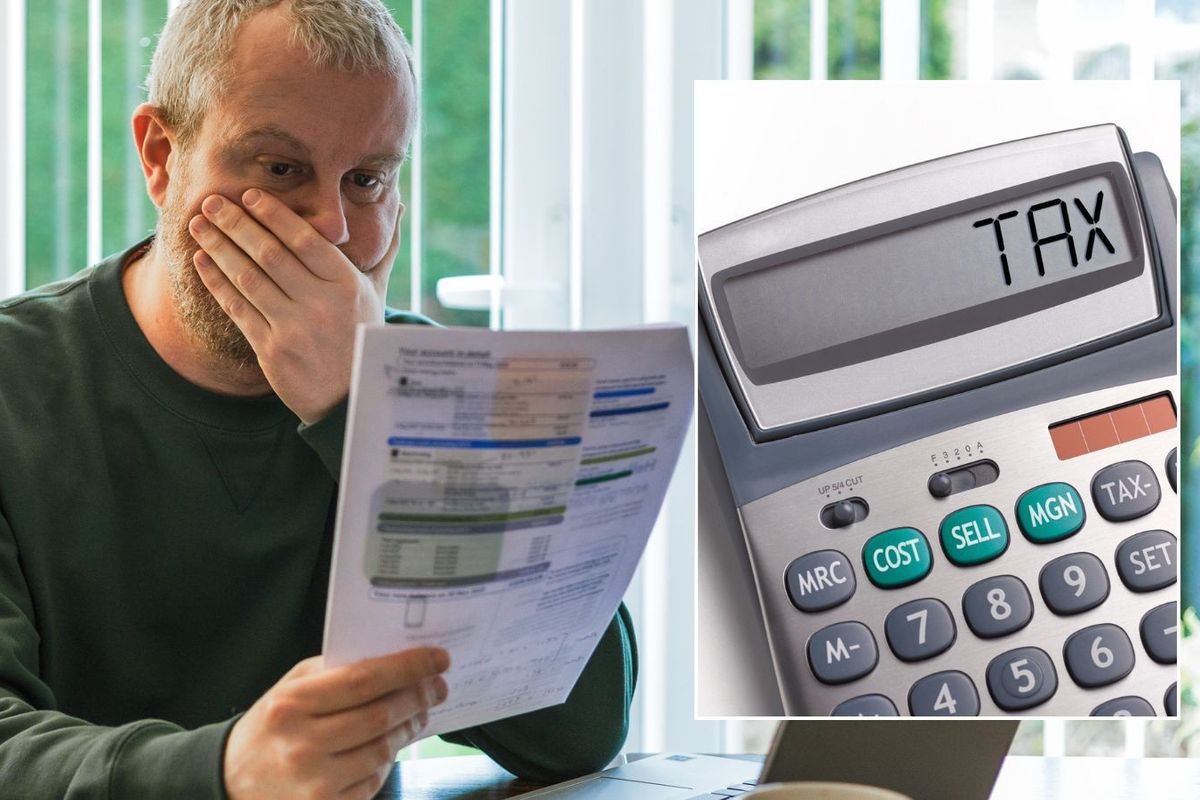 Man looking at form and tax calculator