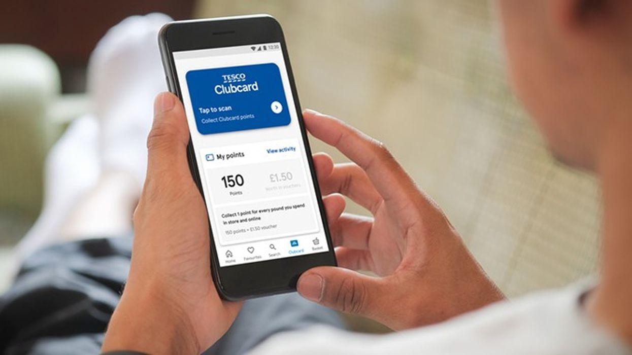 Man looking at his Tesco Clubcard points on a mobile phone