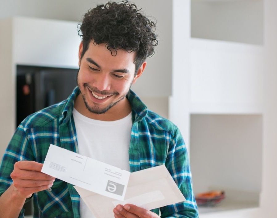 Man looking at letter and Bank of England