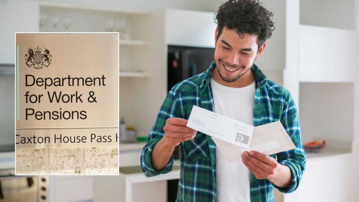 Man looking at letter and DWP sign