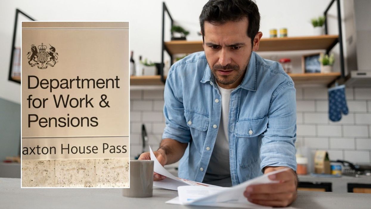 Man looking at letter and DWP sign