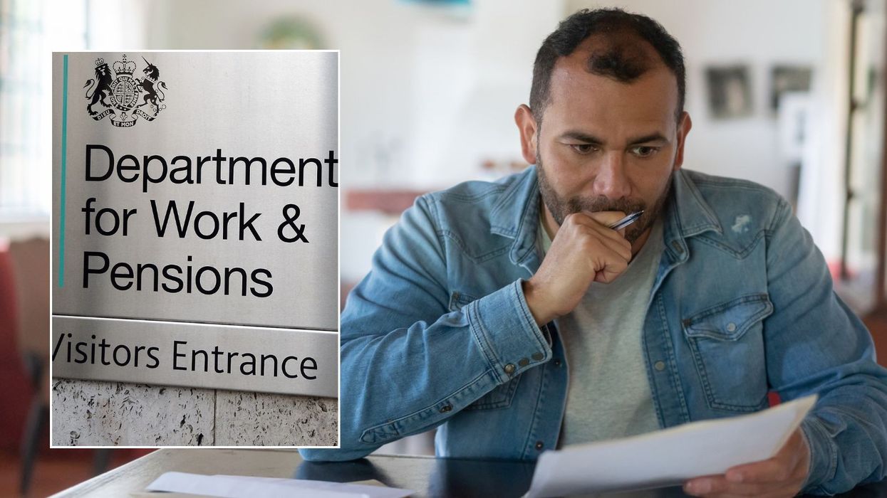 Man looking at letter and DWP sign