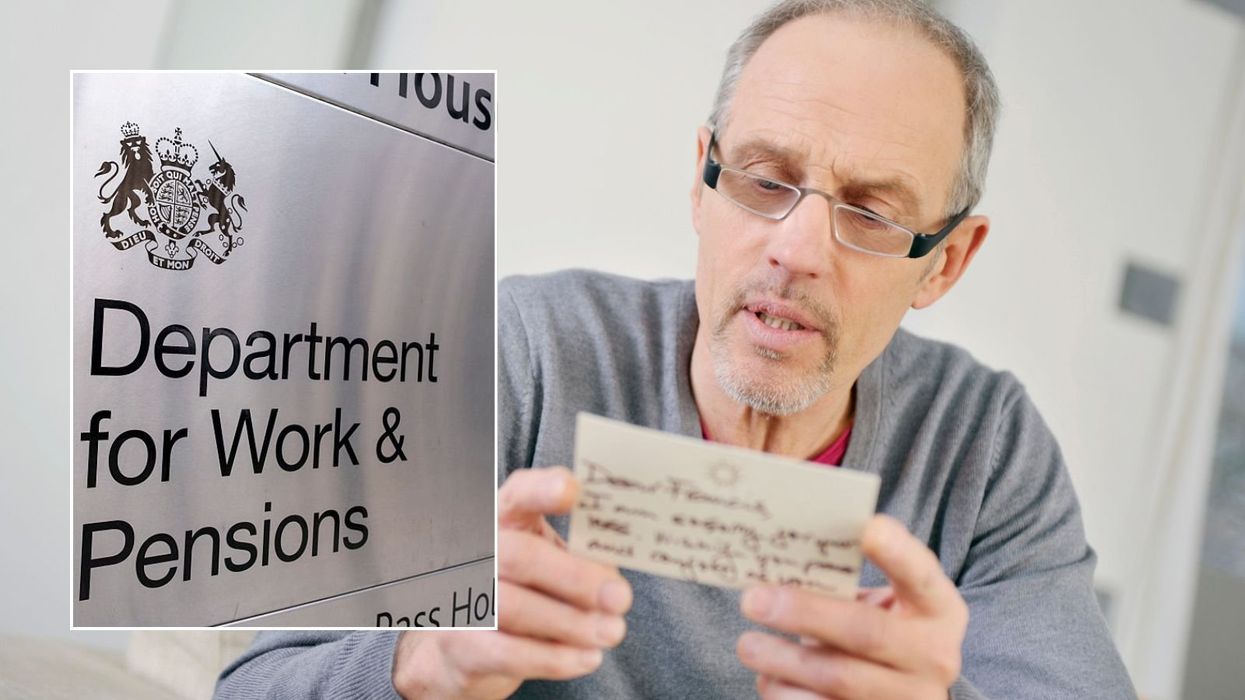 Man looking at letter and DWP sign