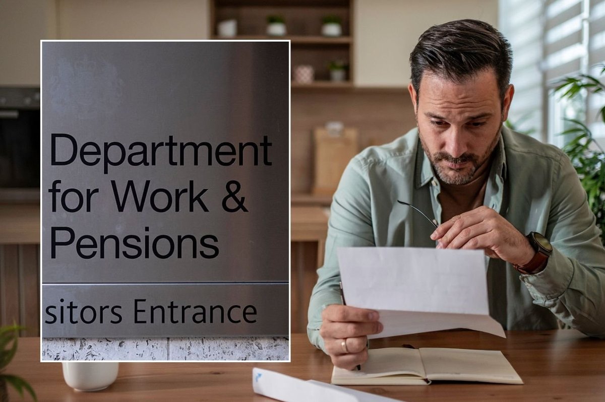 Man looking at letter and DWP sign