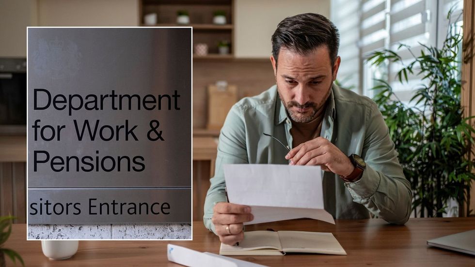 Man looking at letter and DWP sign