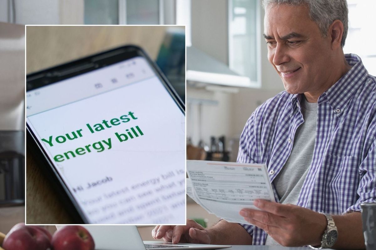 Man looking at letter and energy bill