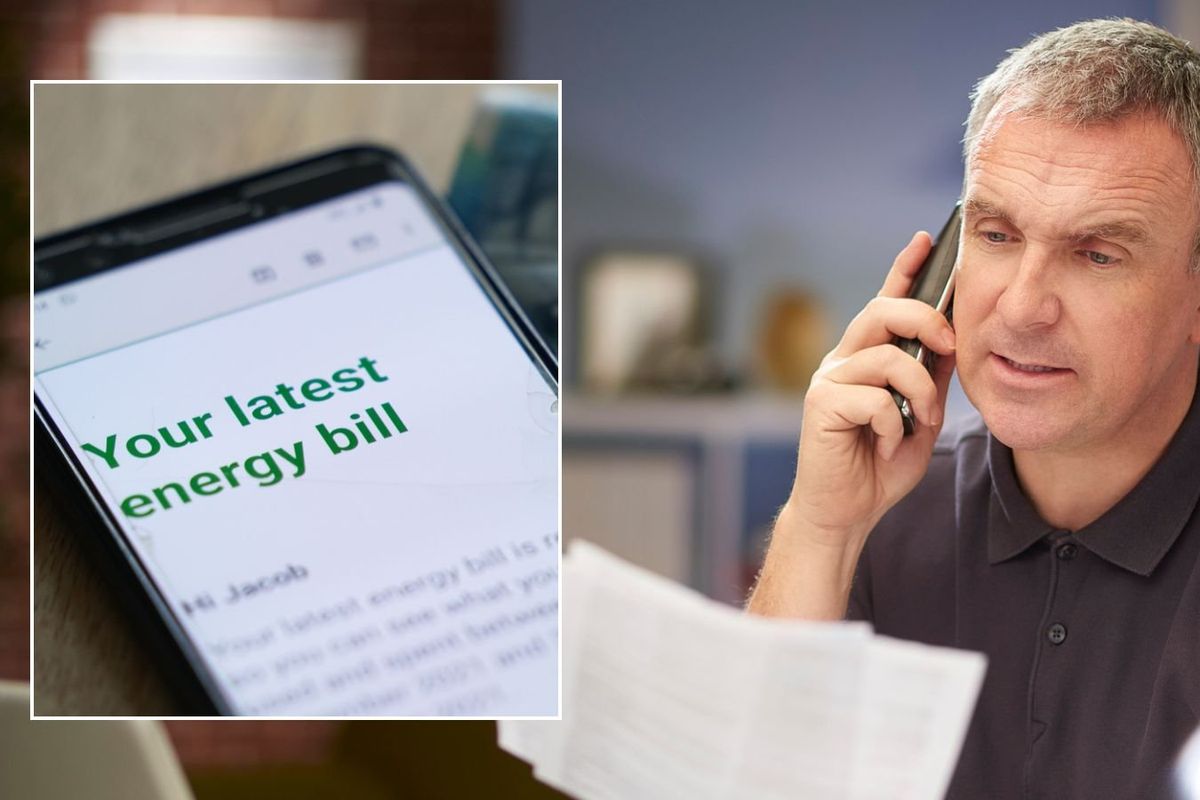Man looking at letter and energy bill