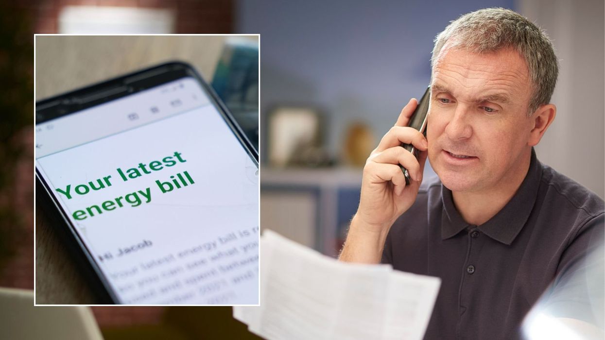Man looking at letter and energy bill