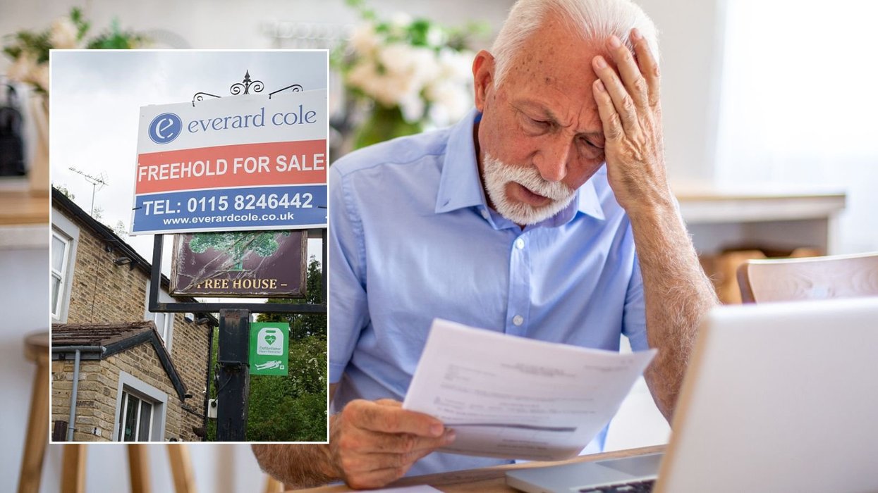 Man looking at letter and freehold sign
