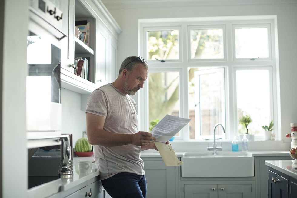 Man looking at letter