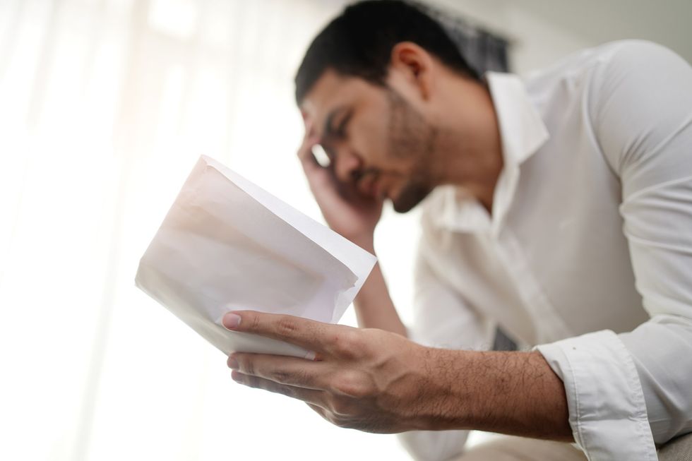 Man looking at pay slip