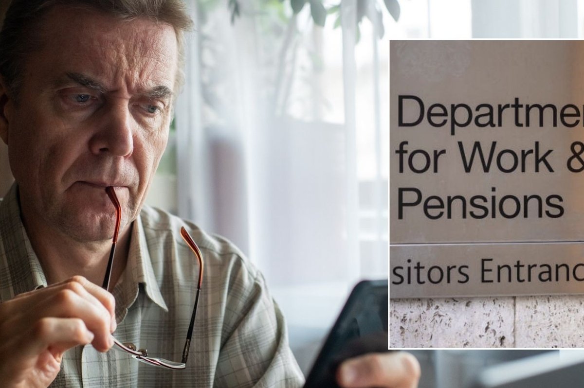 Man looking at phone and DWP sign