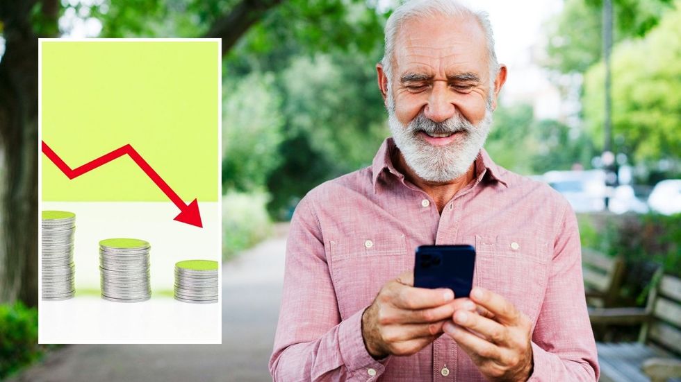 Man looking at phone and inflation drop