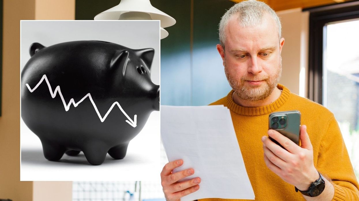 Man looking at phone and interest rate drop