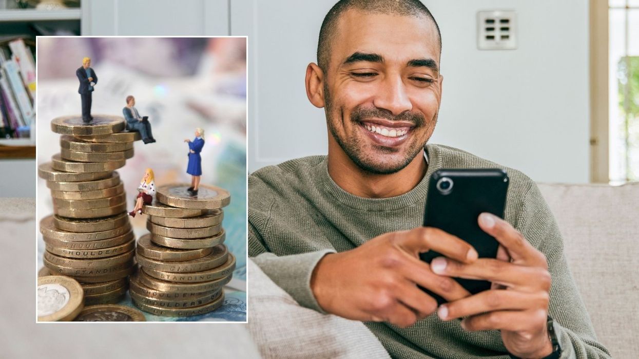 Man looking at phone and pound coins