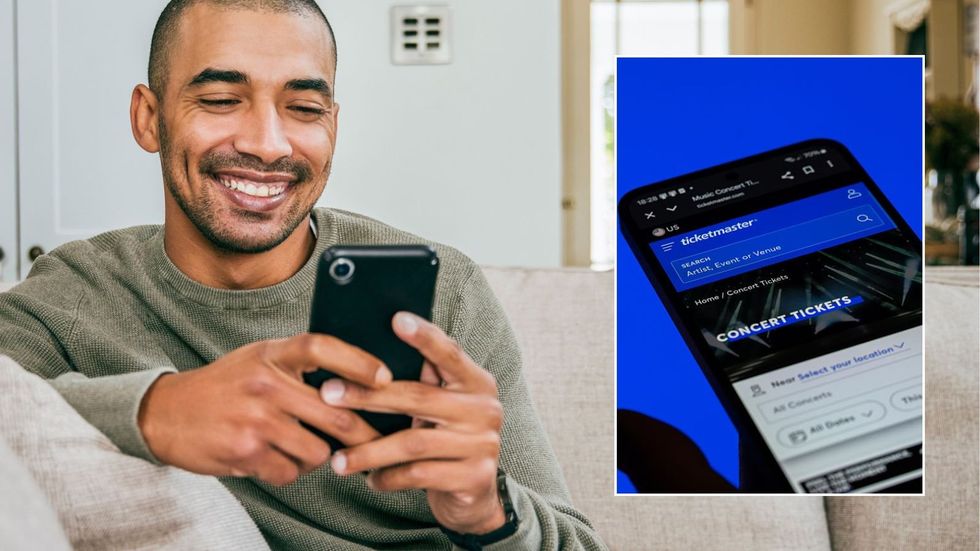 Man looking at phone and Ticketmaster app