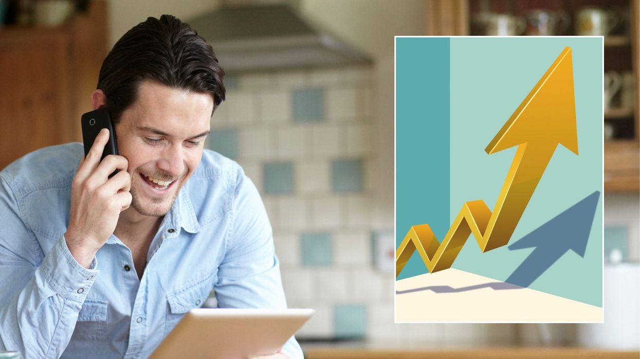 Man looking at tablet and interest rates going up