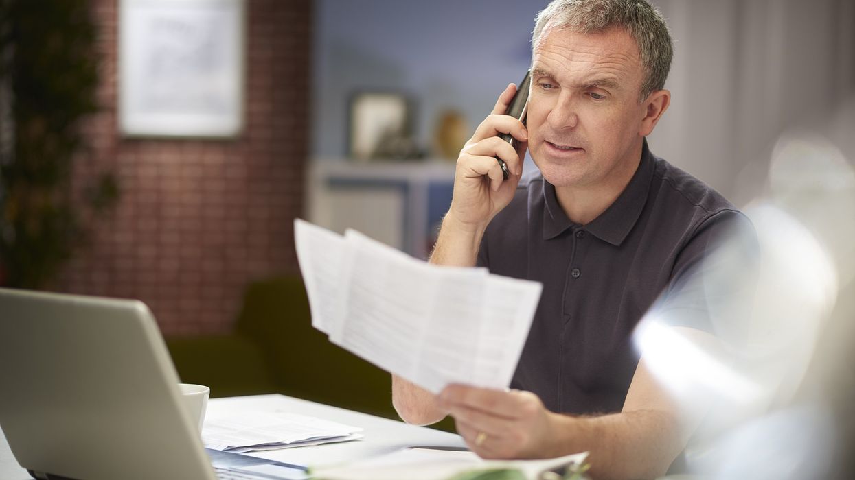 Man looking at tax bills