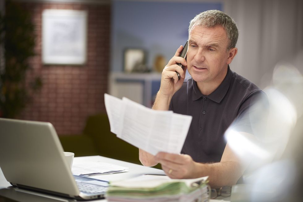 Man looking at tax bills