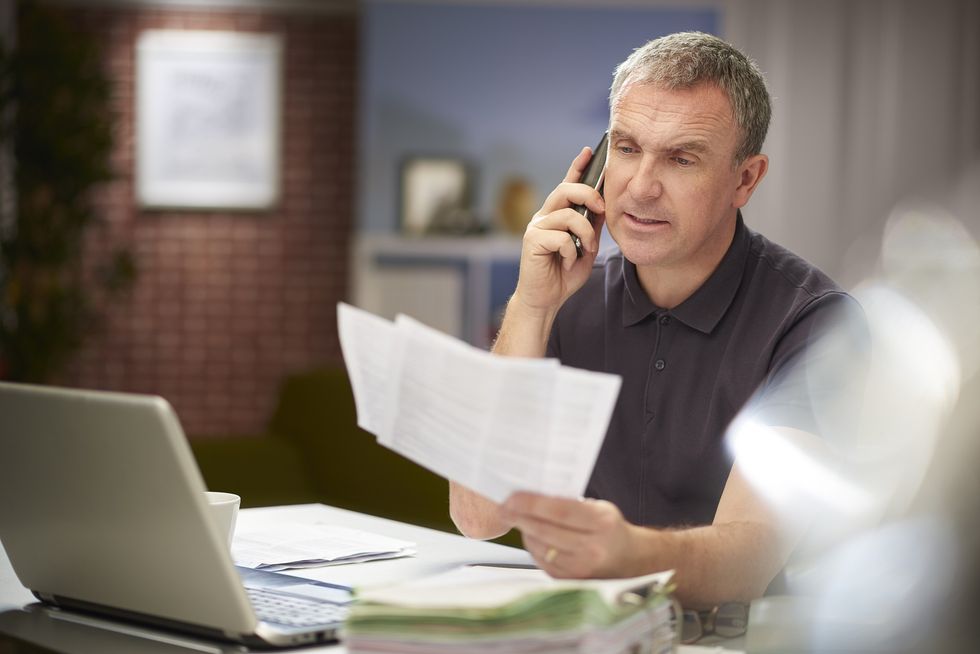 Man looking at taxes