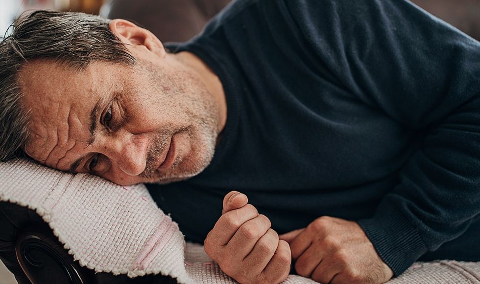 Man looking comatose on a sofa