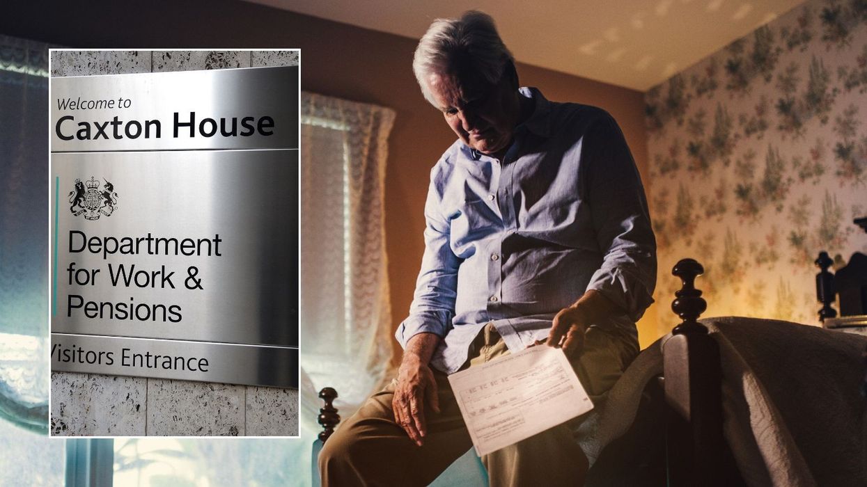 Man looking depressed while holding letter and DWP sign