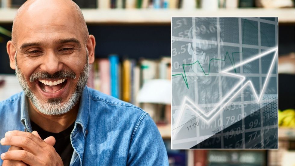 Man looking happy and interest rate graph pointing up