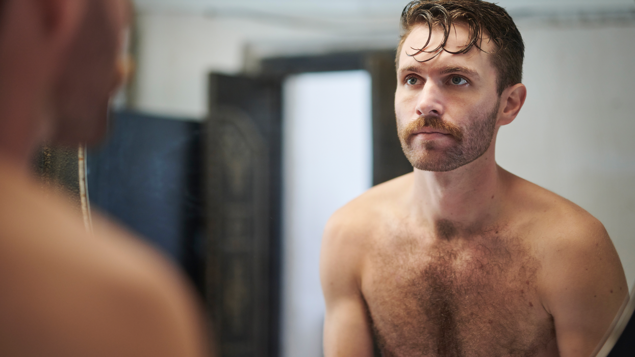 Man looking in the mirror