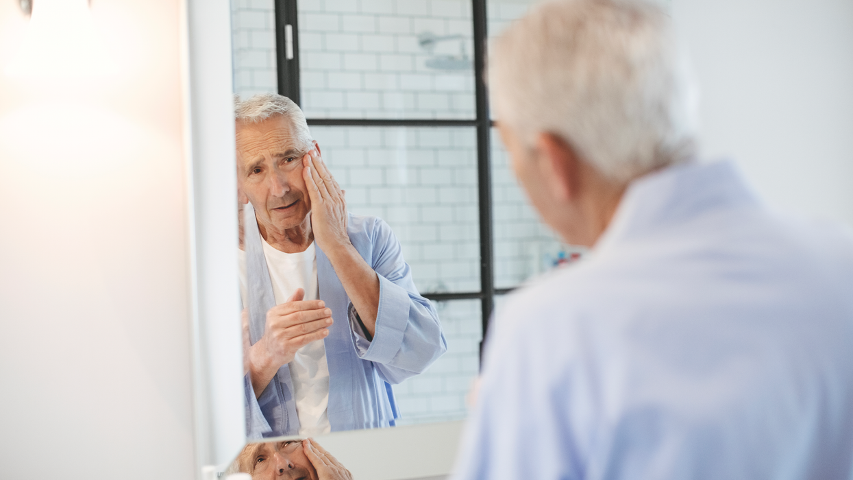 Man looking in the mirror