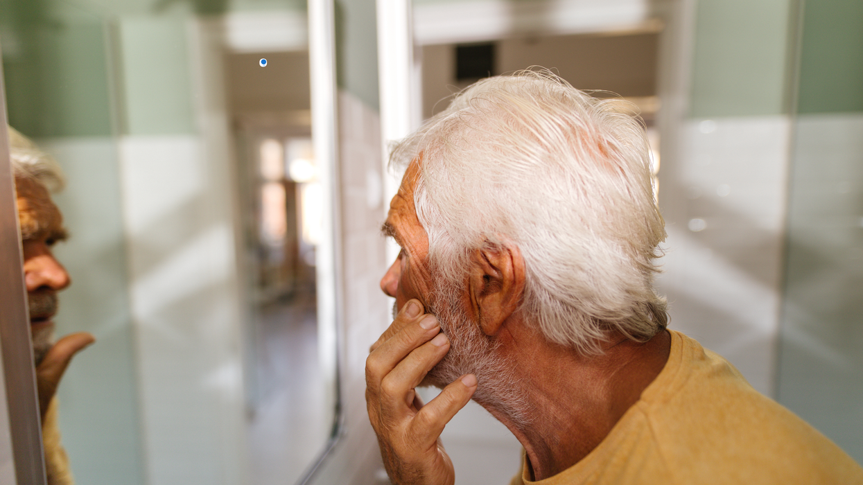 Man looking into the mirror