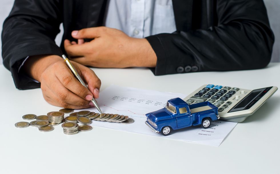 Man looking tat bills