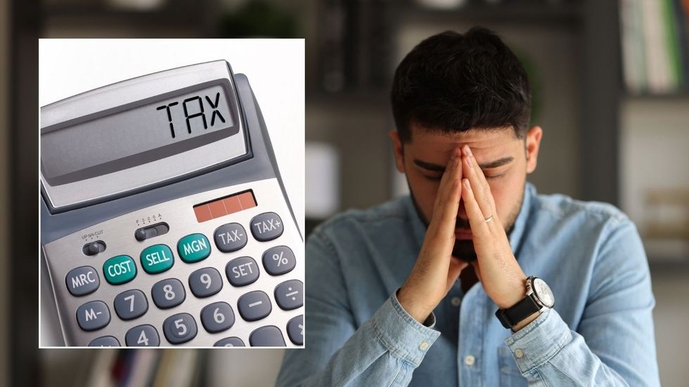 Man looking worried and calculator