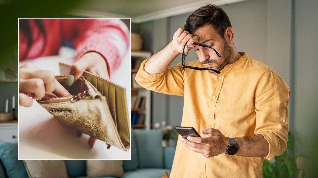 Man looking worried and empty purse