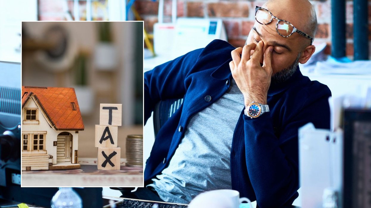 Man looking worried and tax sign