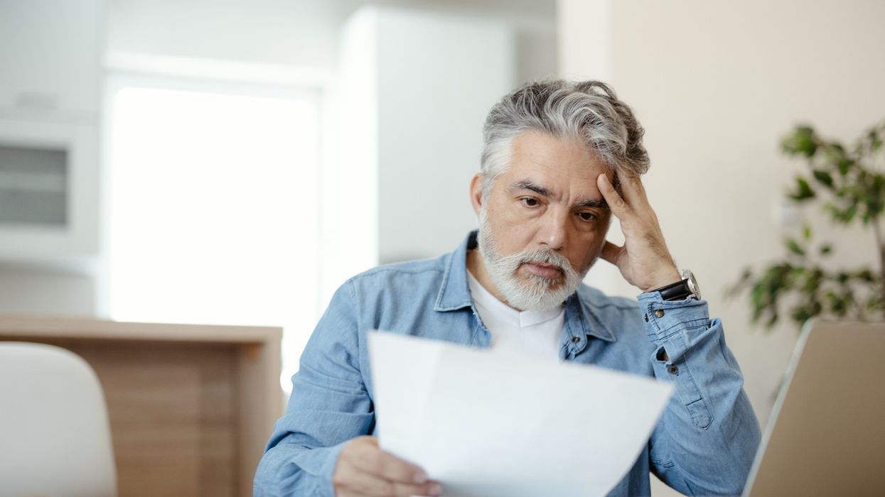 Man looking worried at bill